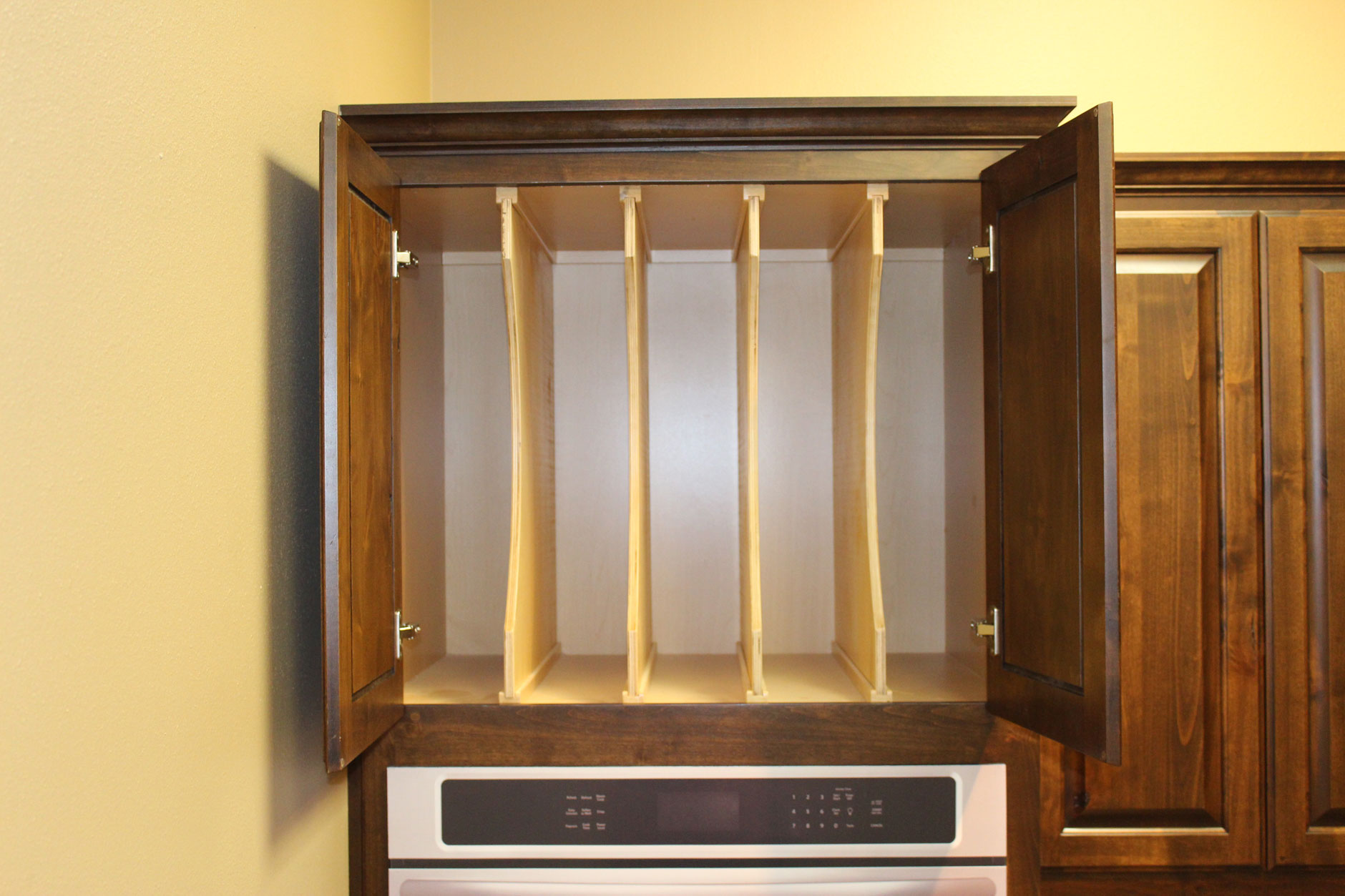 Cookie sheet and platter dividers for kitchen cabinets