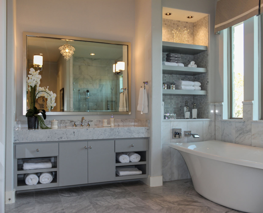 Burrows Cabinets modern gray bathroom vanity cabinets with SoCo doors and soaking tub