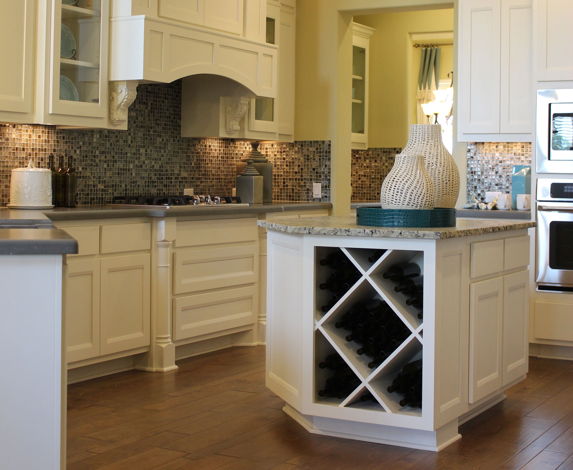kitchen island with wine storage in Bone with Briscoe doors by Burrows Cabinets