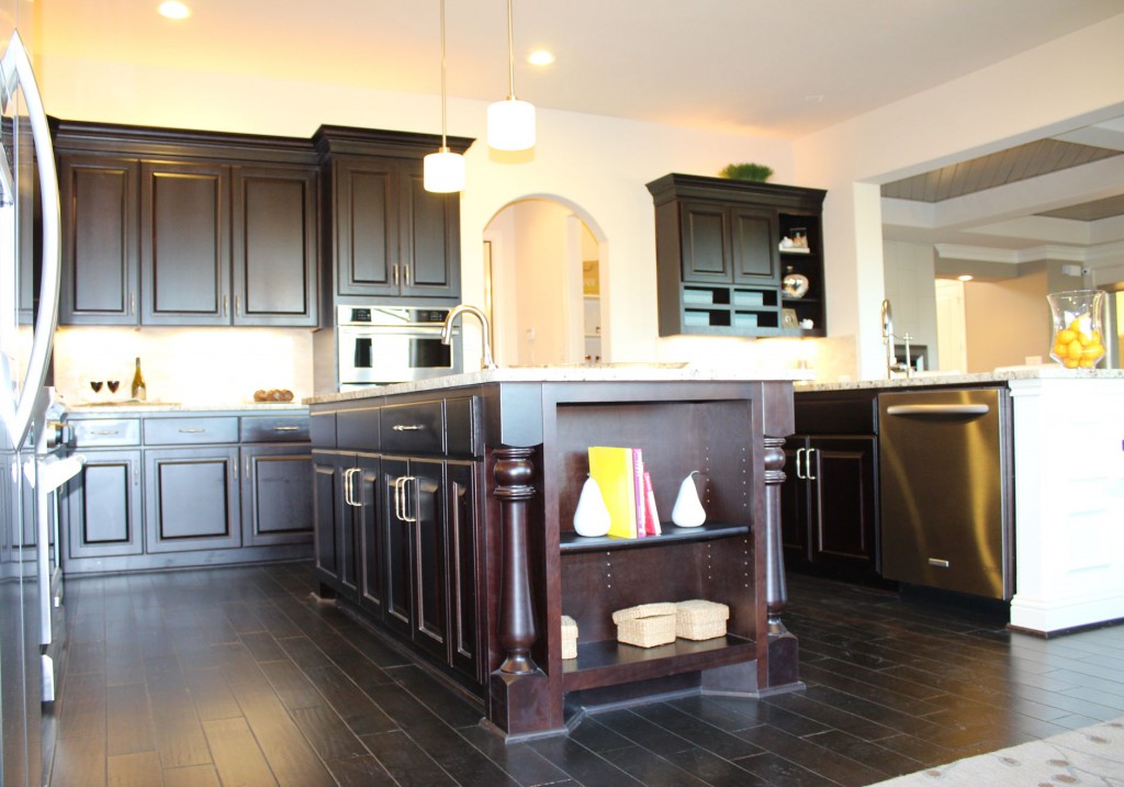 Kitchen island with monaco corner posts and open shelves in Espresso by Burrows Cabinets