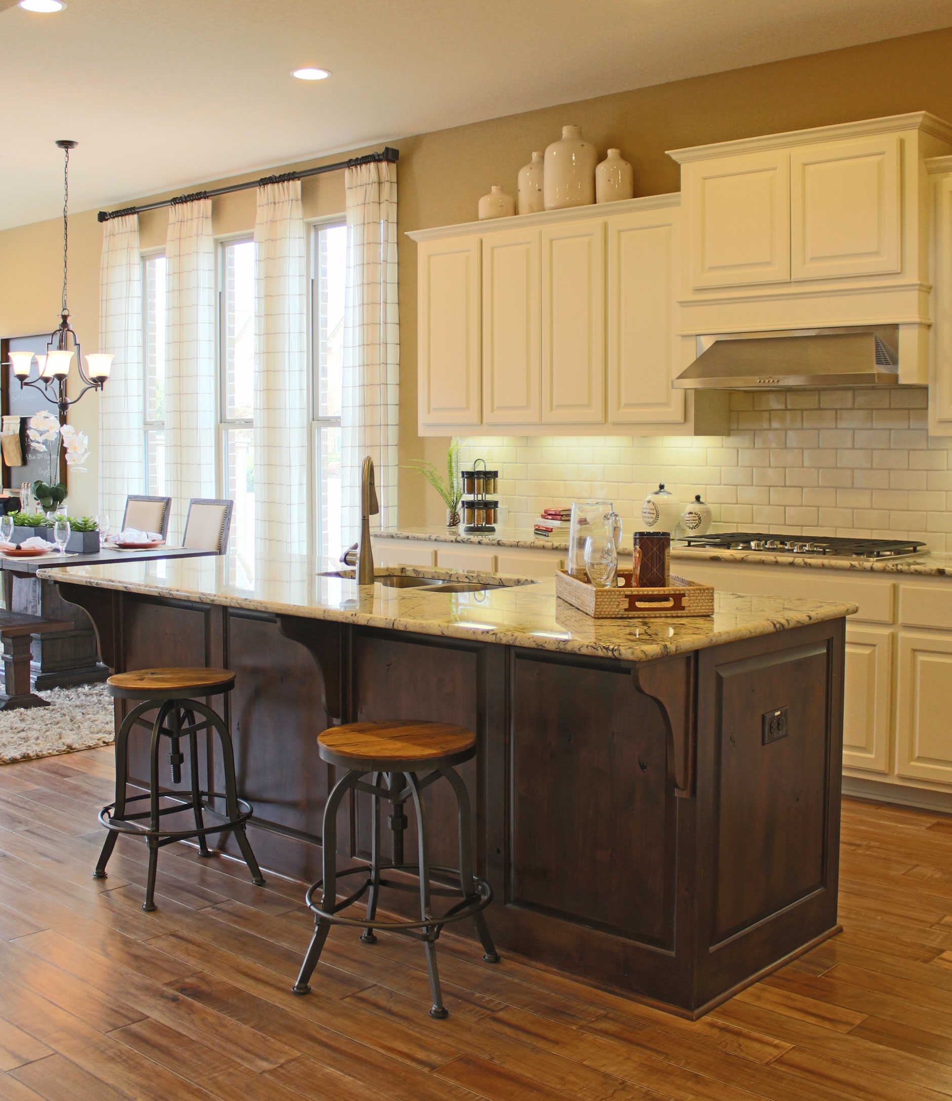 Kitchen island with corbels in knotty alder by Burrows Cabinets