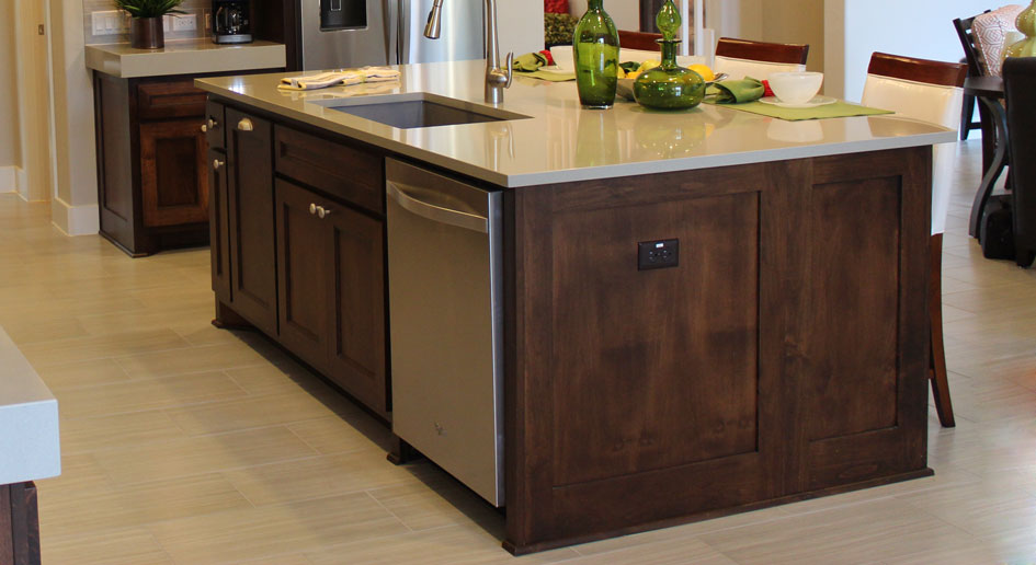 Large kitchen island with paneled end by Burrows Cabinets
