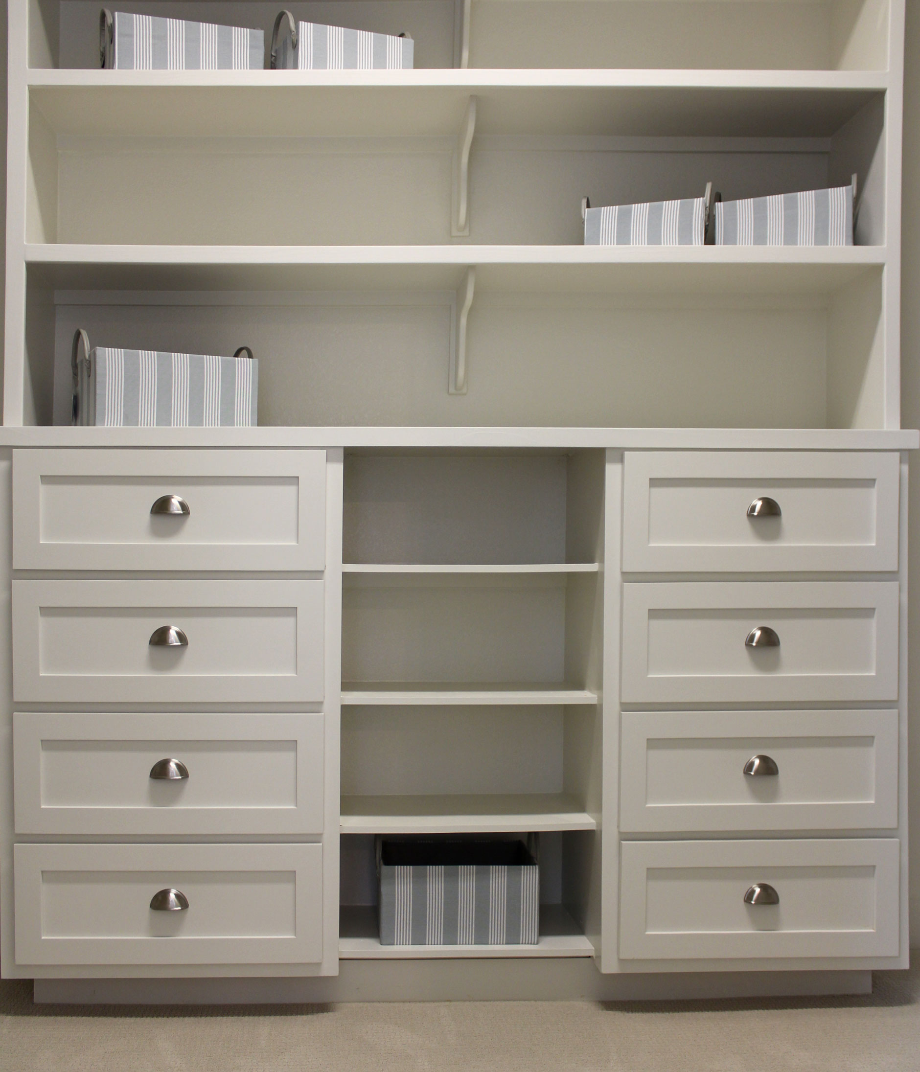 Closet storage with white shaker style drawer fronts