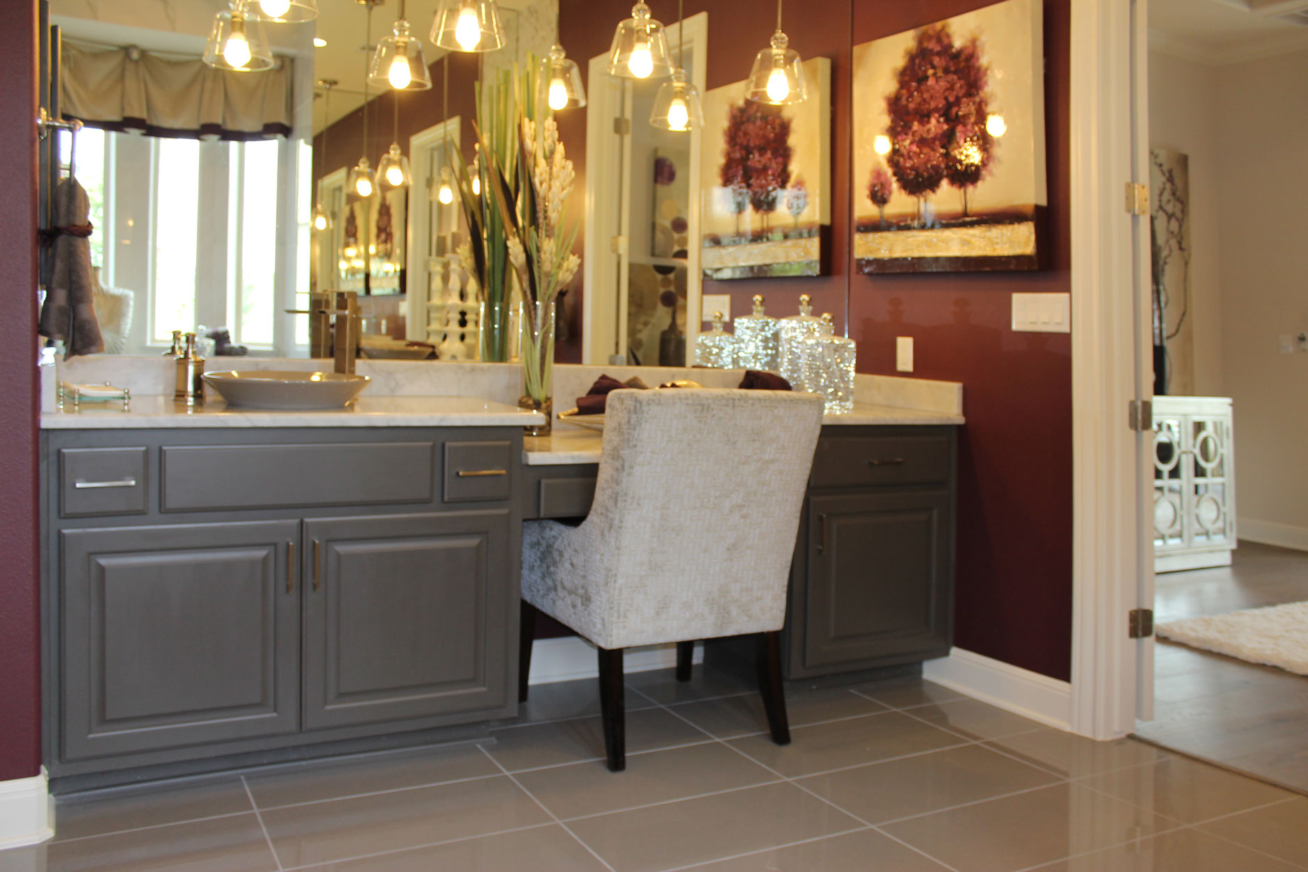 Primary bath cabinets in Umber with knee space by Burrows Cabinets