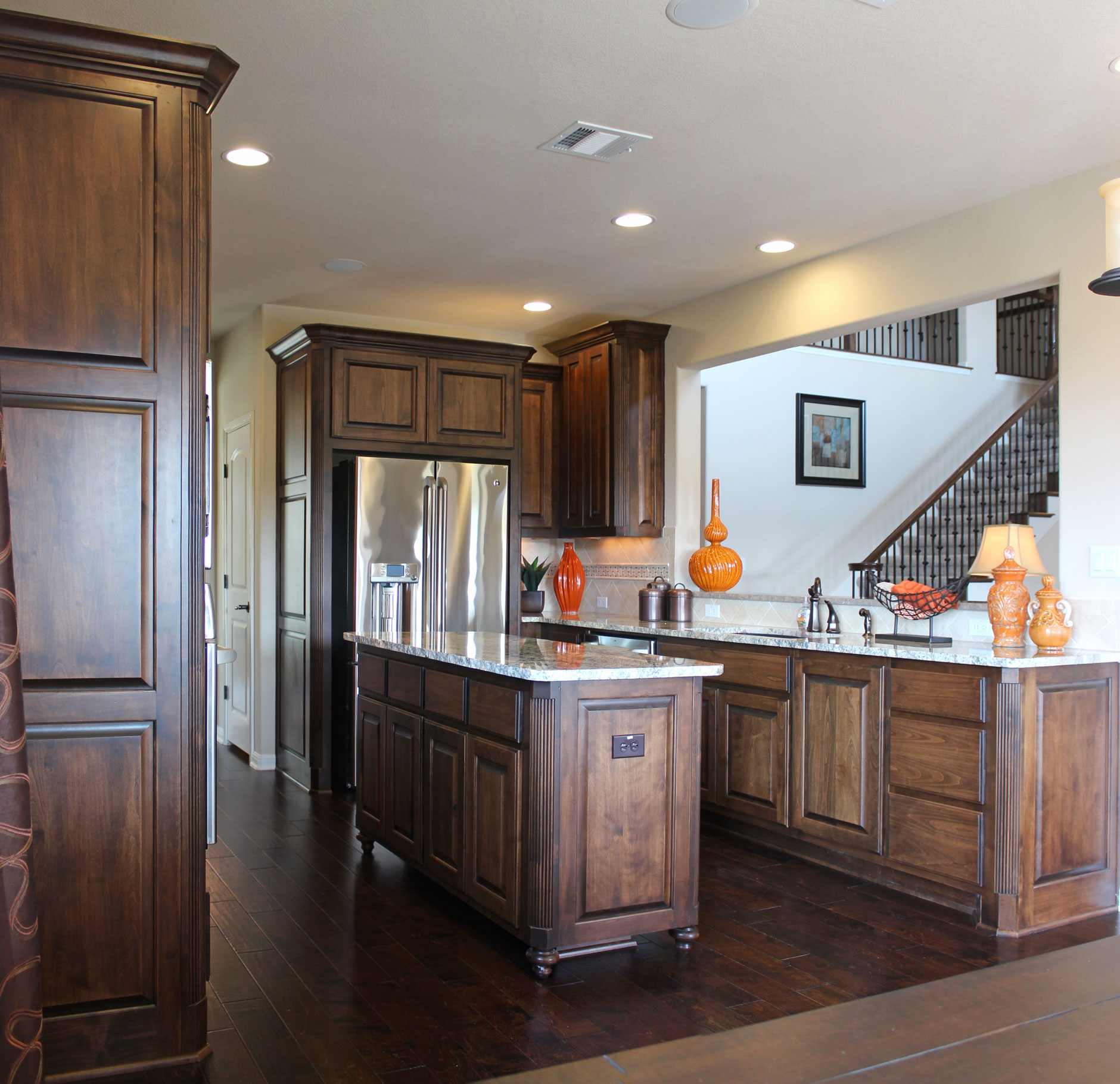 Burrows Cabinets kitchen in stained knotty alder and appliance end panels