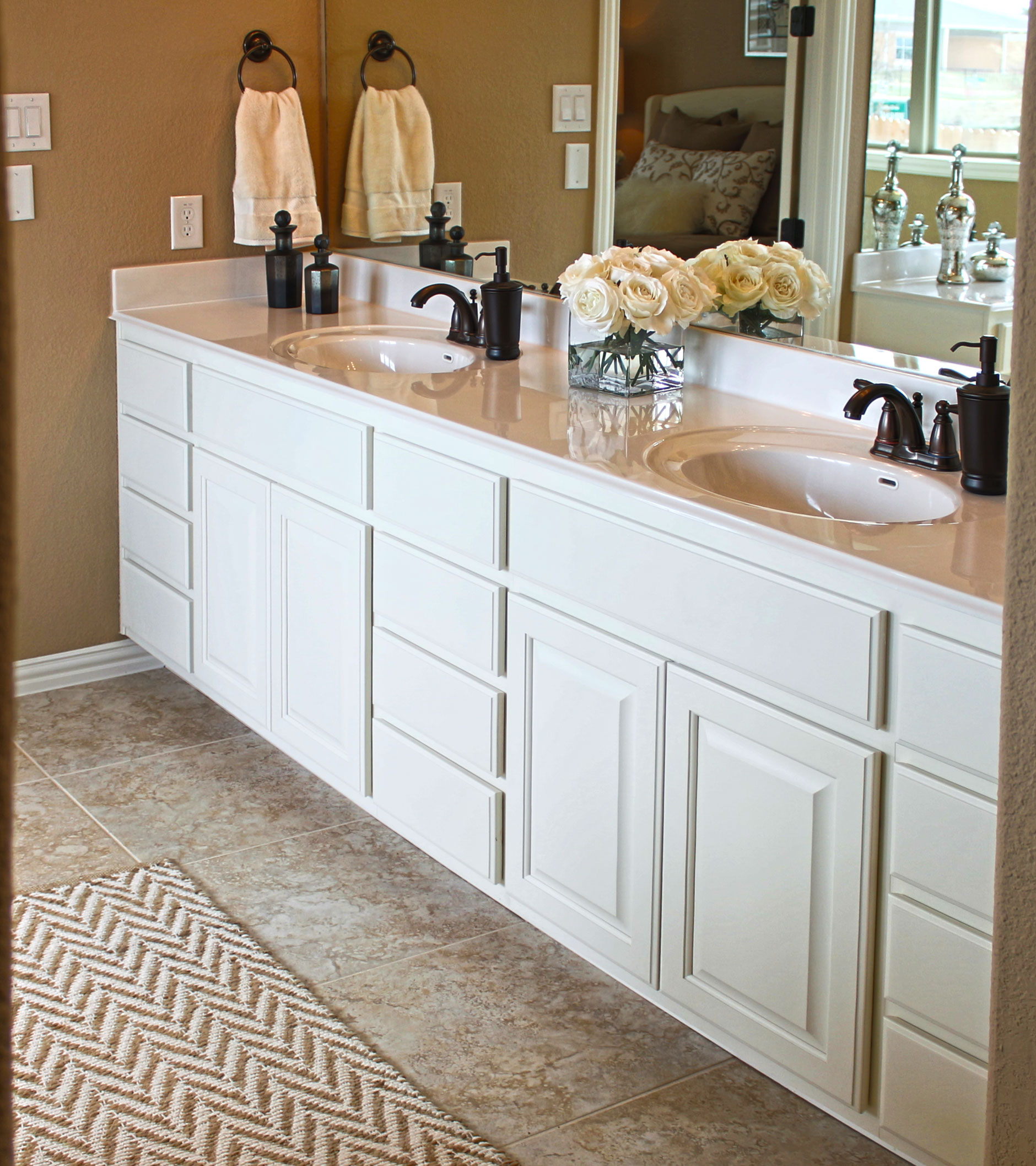 Parkside at Mayfield Ranch master bath cabinets in Bone by Burrows Cabinets