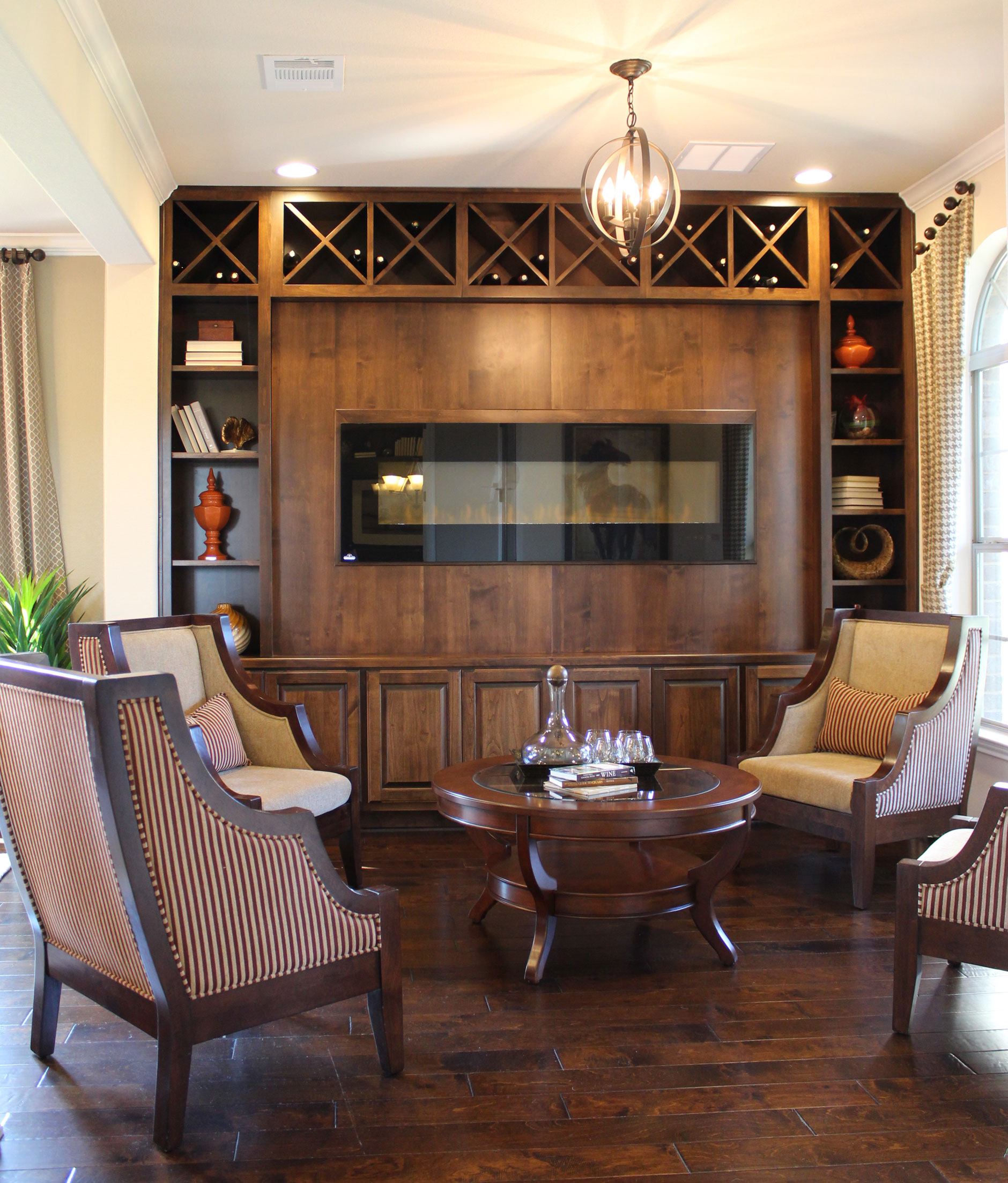 Burrows Cabinets wood fireplace surround with bookshelves in alder with verona finish