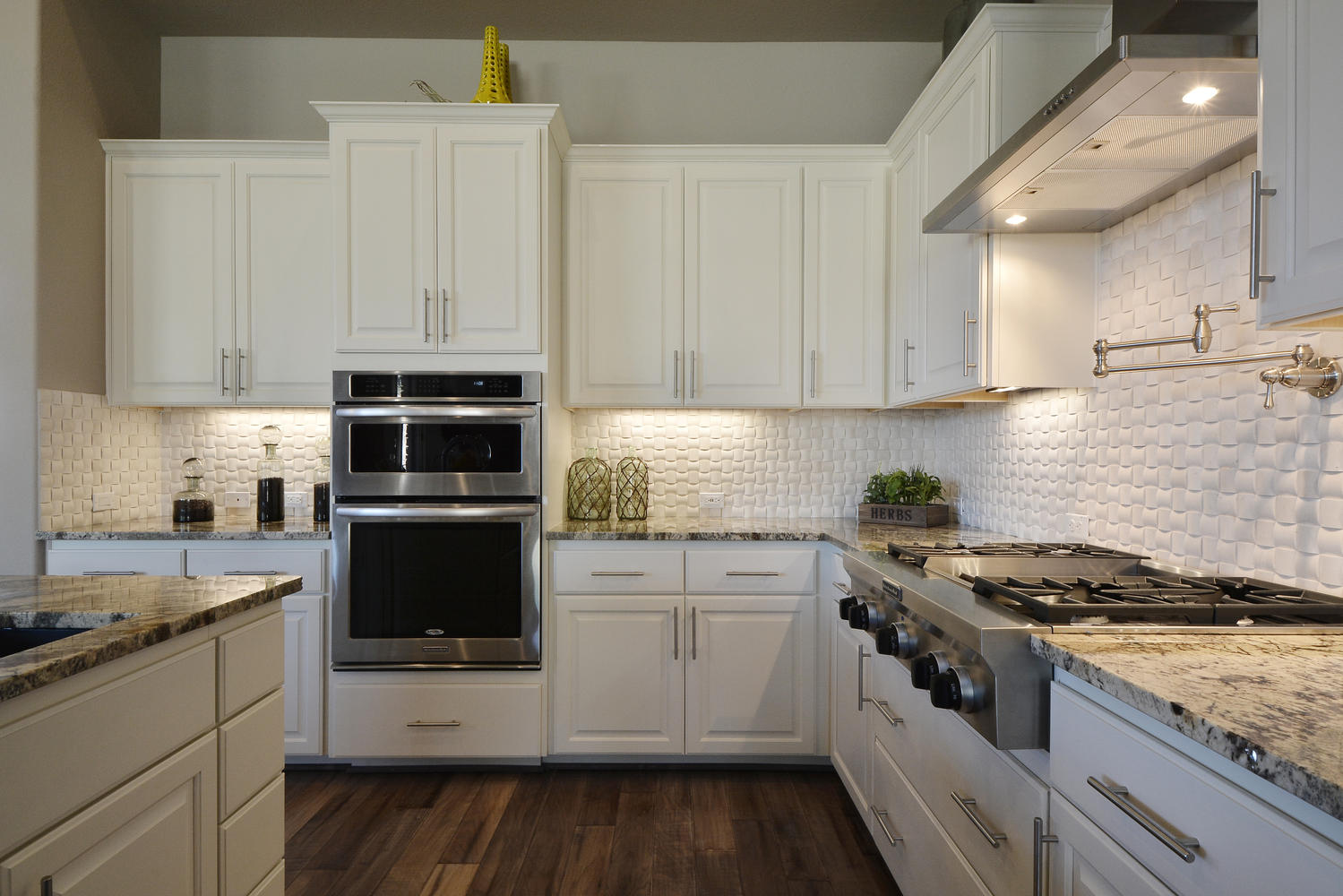 Burrows Cabinets Bone white kitchen with white subway tile