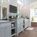 Burrows Cabinets shaker style primary bath cabinets with open shelves and bumped up drawer stacks