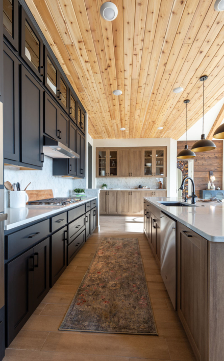 Kitchen with Breu black paint perimeter cabinets and EVRGRN Reveur island and buffet cabinets