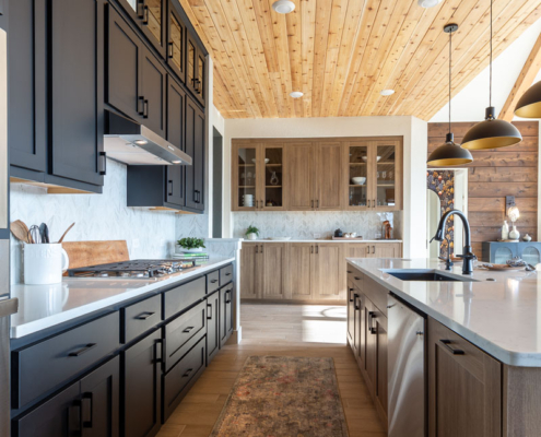 Kitchen with Breu black paint perimeter cabinets and EVRGRN Reveur island and buffet cabinets