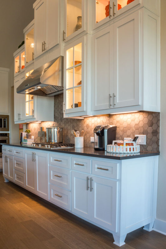 Burrows Cabinets' kitchen with mullion doors, Shaker doors in Bone white and Dallas feet