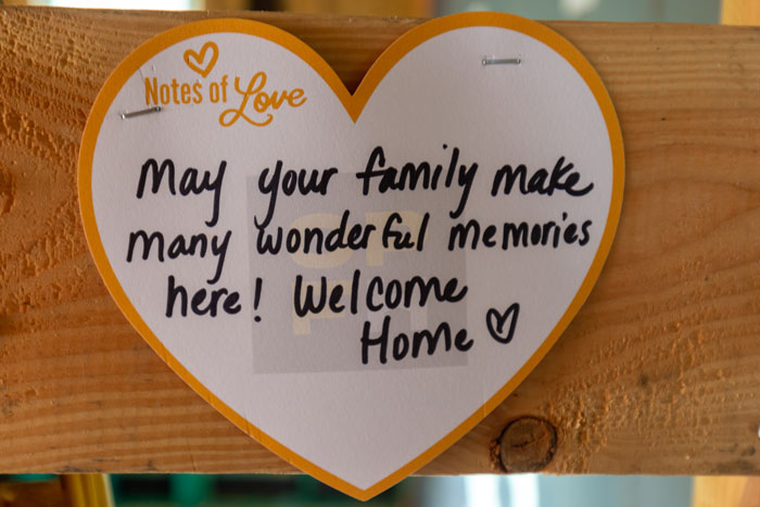 Notes of love and support from the community left inside the walls of the home