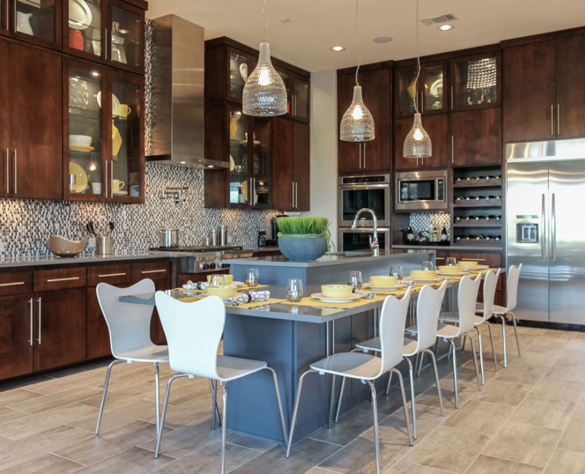 Burrows Cabinets' kitchen island cabinets with modern SoCo doors painted gray and modern perimeter cabinets in Alder