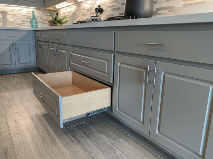 Kitchen base cabinets with full extension pot pan drawer in Bristol grey