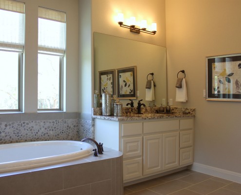 Burrows Cabinets primary bath vanity cabinets in Bone white