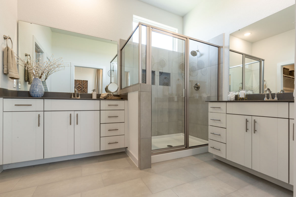 Bathroom in EVRGRN Luxe with dual vanities and 3pc doors