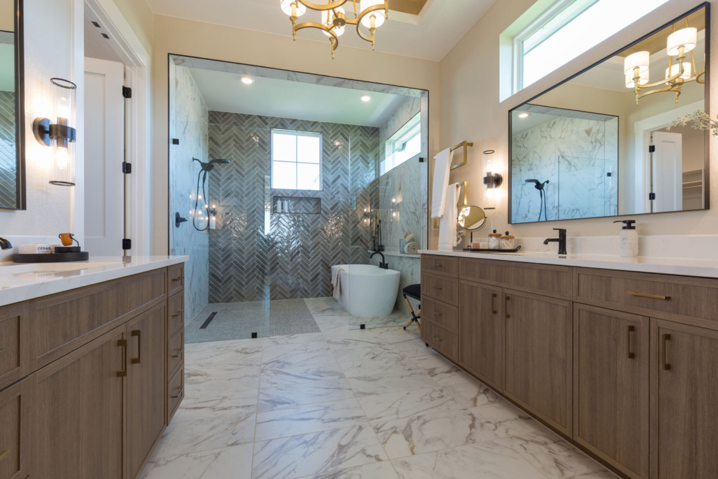 Bathroom vanity cabinets in Reveur medium woodgrain with slim shaker doors and enclosed soaking tub