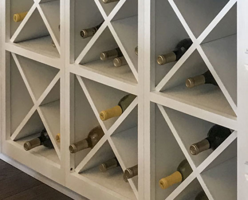 Six Big X wine racks together in dining hutch