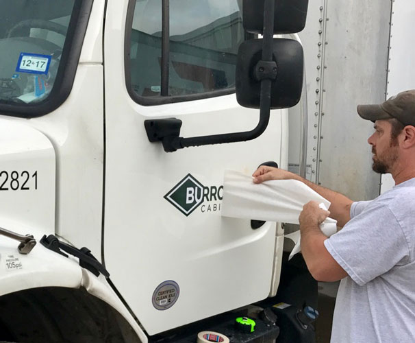 Burrows Cabinets truck decal logo install in progress