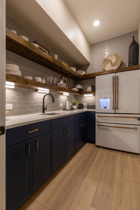 Butler's Pantry with Naval blue cabinets, Slim Shaker doors and floating rustic wood shelves