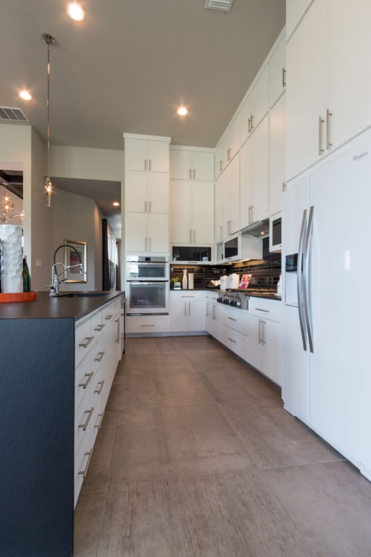 Burrows Cabinets' full overlay kitchen with modern white SoCo doors