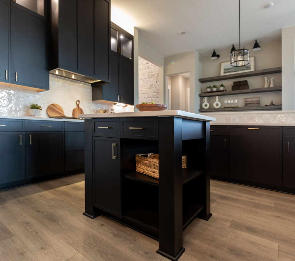 Kitchen island in Breu black paint with Slim Shaker doors and gold pulls