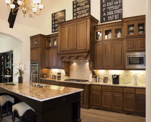 Burrows Cabinets' kitchen cabinets with raised panel doors in custom Maple stain