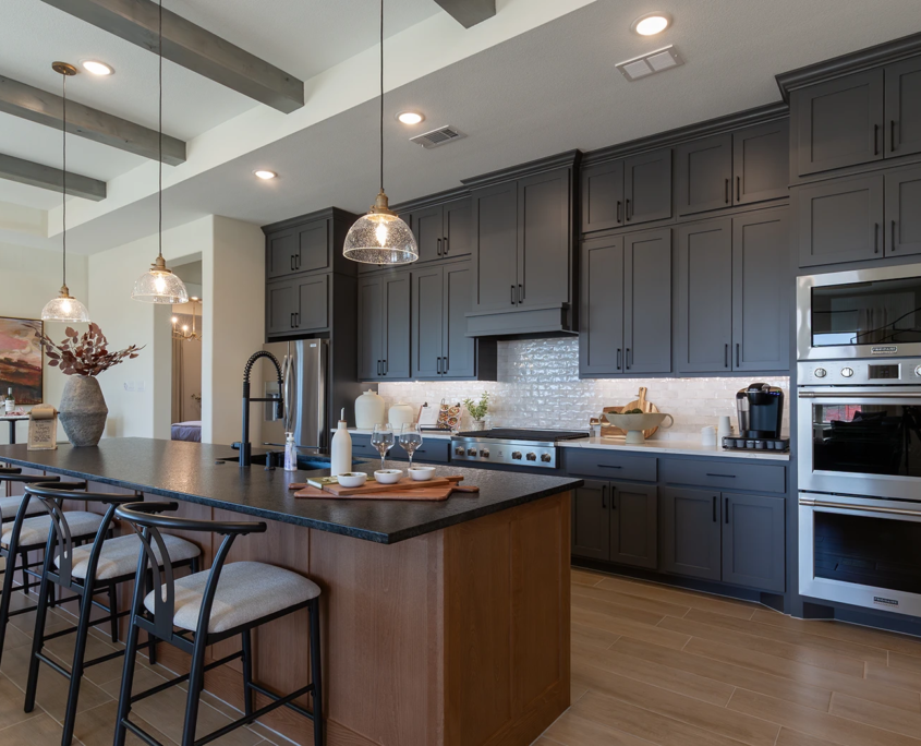 Kitchen in Beech Bali Island with Greystone perimeter cabinets and Ellis flat panel cabinet doors