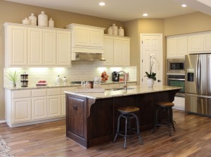 White perimeter cabinets and knotty alder island by Burrows Cabinets