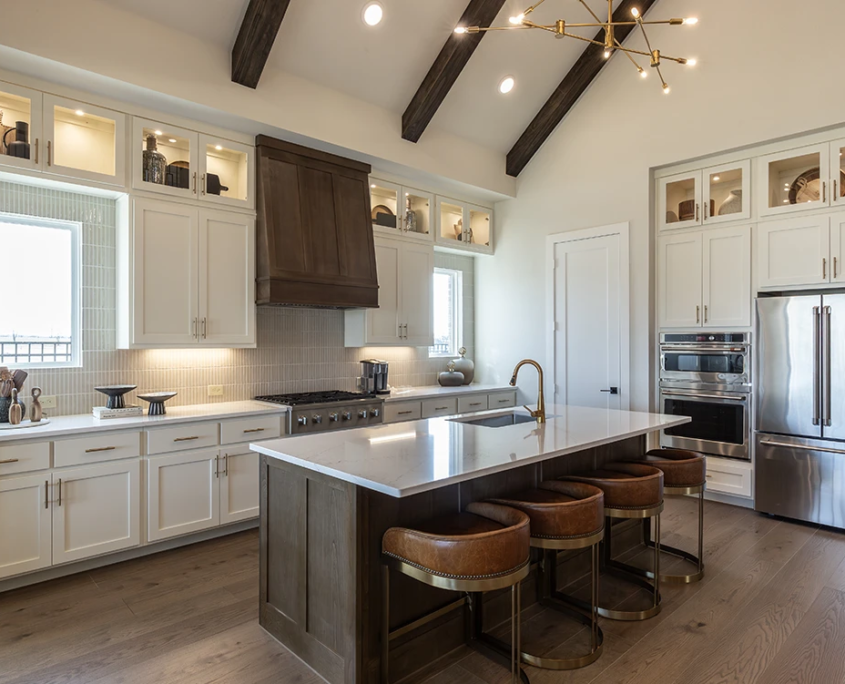 Kitchen Island in wood Beech Levanzo with paneled island back, Artisan vent hood and Shaker doors, Bone perimeter cabinets