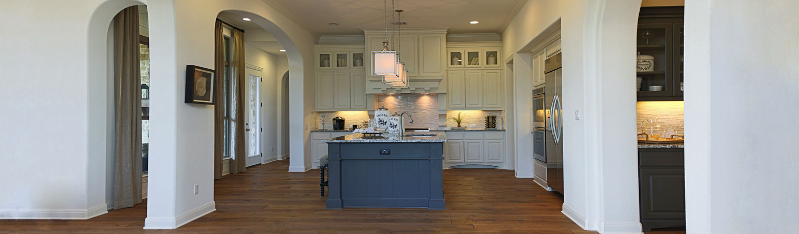 Burrows Cabinets' kitchen in bone with umber island