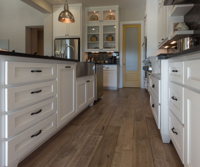 White kitchen base cabinets with banks of drawers