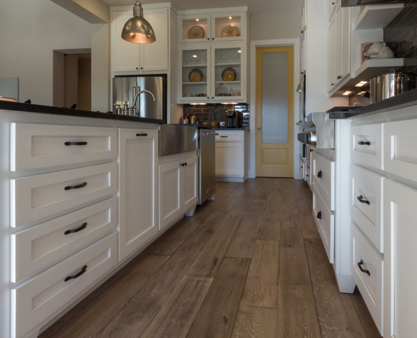 White kitchen base cabinets with banks of drawers