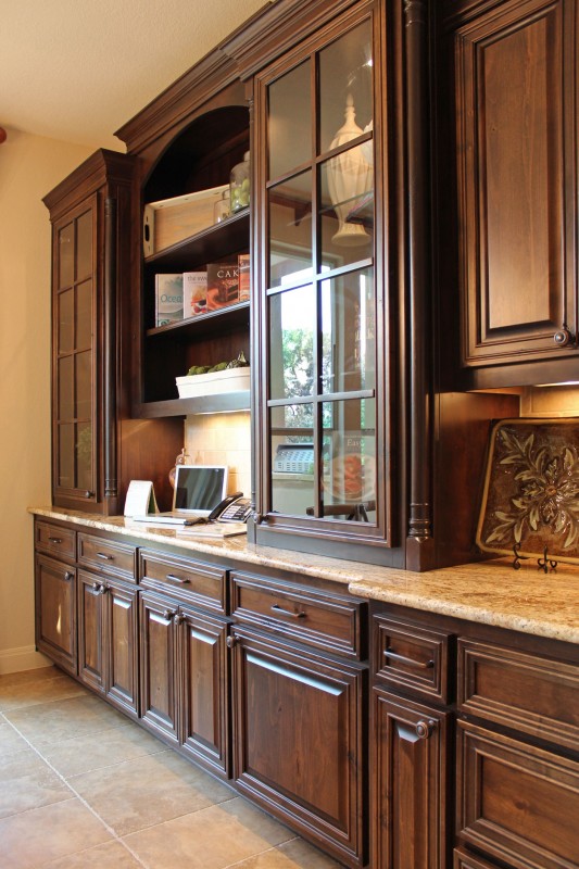 Burrows Cabinets' kitchen hutch with glass doors and mullions in stained knotty alder