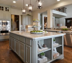 Burrows Cabinets kitchen island in Ecru with bookshelves and integrated corners
