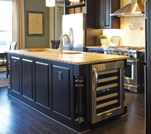 Burrows Cabinets kitchen island with Monaco Posts and wine refrigerator (C) 2014 Burrows Cabinets