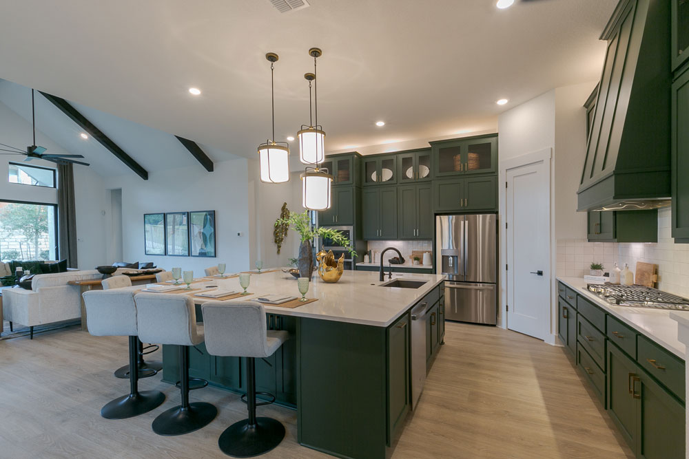 Kitchen Island with Saba green cabinets and Shaker doors