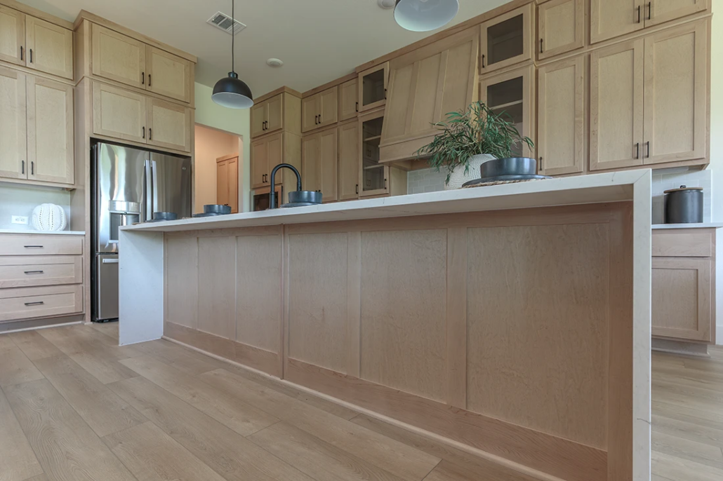 Kitchen island with paneled back in Maple Savaii