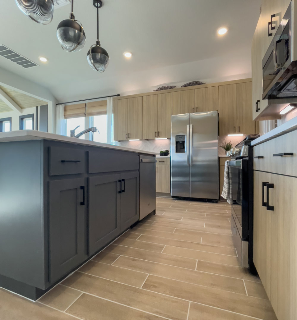 Kitchen in EVRGRN Laurent with 1-piece doors and Island in Greystone with Shaker doors