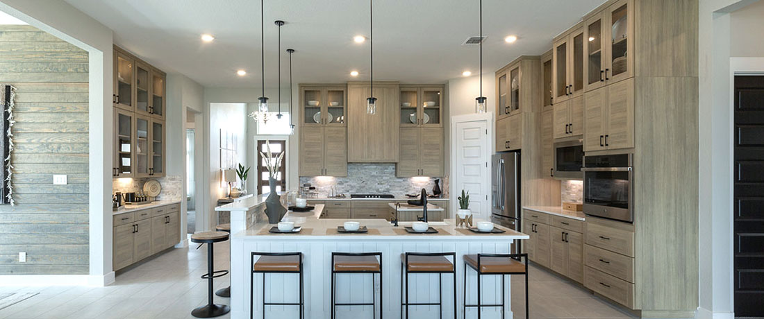 Kitchen in EVRGRN Laurent with 3pc doors, built-in buffet, glass uppers and custom range hood