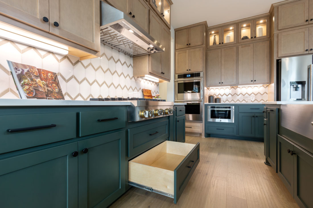 Base cabinet full extension pot and pan drawer below the cooktop