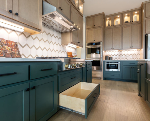 Base cabinet full extension pot and pan drawer below the cooktop