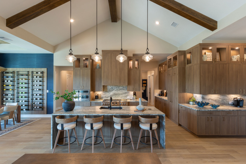 Kitchen with Slim Shaker doors in warm woodgrain Reveur EVRGRN engineered wood and built-in appliance panels