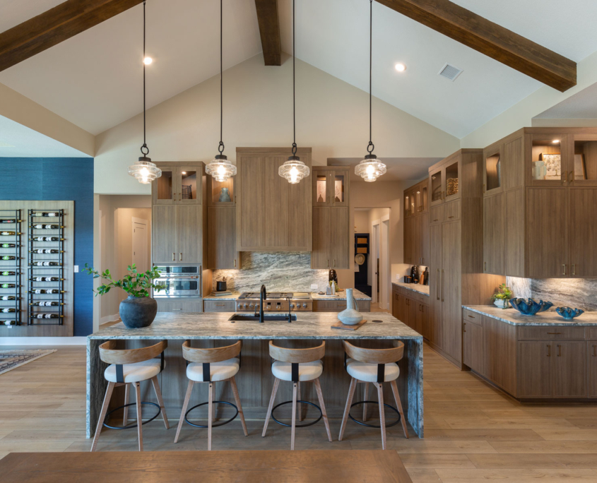 Kitchen with Slim Shaker doors in warm woodgrain Reveur EVRGRN engineered wood and built-in appliance panels