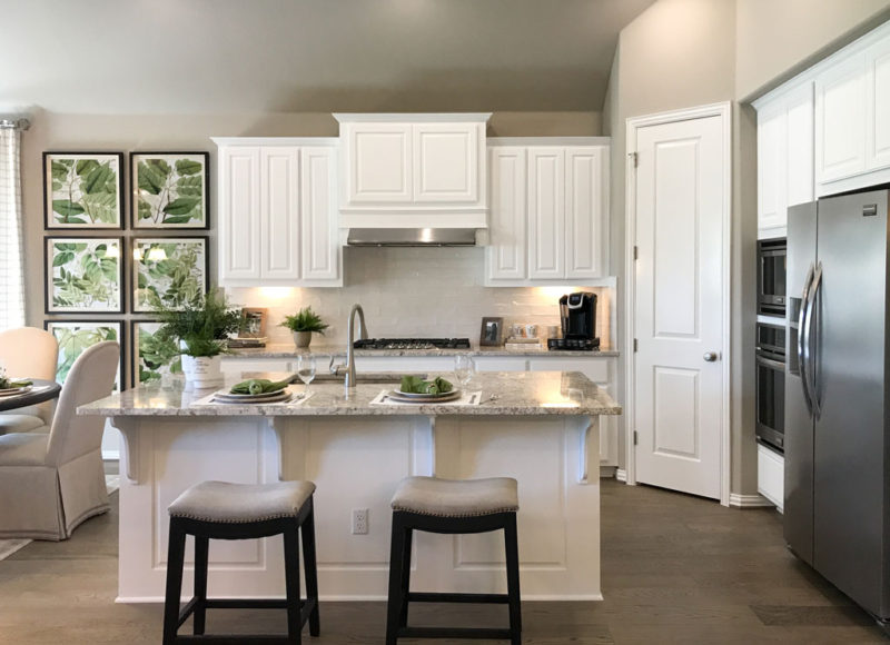 Burrows Cabinets' kitchen cabinets with raised panel doors in Frost white