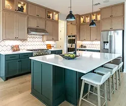 Kitchen with Saba green paint base and maple Savaii upper cabinets