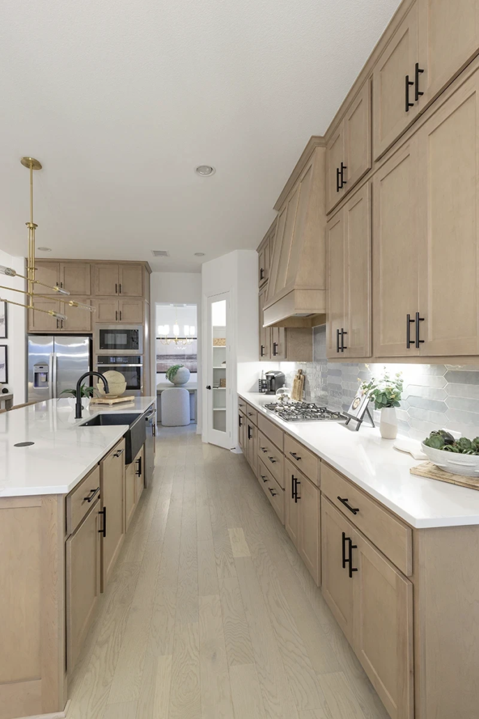 Kitchen cabinets in Maple Savaii with Artisan vent hood and Shaker doors