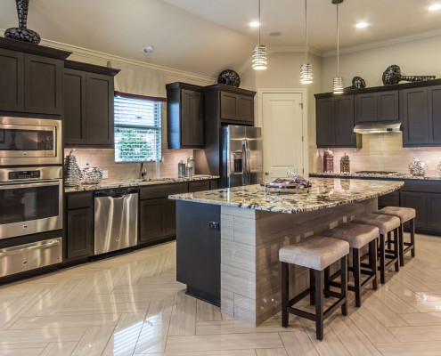 Burrows Cabinets kitchen with shaker style cabinets in Umber gray