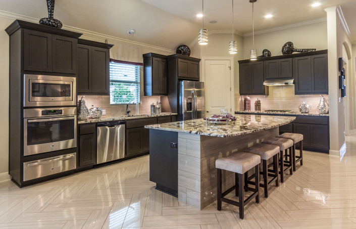 Burrows Cabinets kitchen with shaker style cabinets in Umber gray